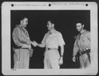 Thumbnail for Marianas Islands.  Major Charles W. Sweeney, Pilot Of The B-29 'Bockscar' Which Dropped The Atomic Bomb On Nagasaki, Japan, 9 August 1945, Is Shown Before His Mission Shaking Hands With Colonel Paul W. Tibbets, Pilot Of The B-29 'Enola Gay' Which Atom-Bom - Page 1