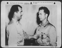 On the eve of leaving New Guinea for leave at his home in Poplar, Wisc., Capt. Richard I. Bong, 23, ranking "Ace" in the Southwest Pacific, is decorated with the Distinguished Service Cross by Brig. General Paul B. Wortsmith, 5th AF Fighter - Page 1