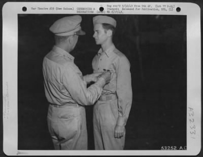 Consolidated > Capt. Curran L. Jones of Columbia, S.C., is pictured being decorated by Lt. General George C. Kenney with the Air Medal and Distinguished Flying Cross, at ceremonies held in New Guinea, on the eve of Jones' departure for the United States and a new