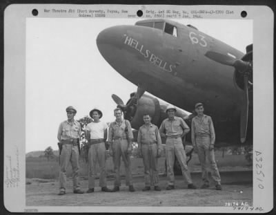 Thumbnail for Consolidated > C-47 transport plane, "Hellsbells" and its crew from 6th Troop Carrier Sq., 5th Air Force, Wards Drome, Port Moresby, Papua, New Guinea. Left to right: Capt. Wm. D. Wells, Ovid, N.Y., pilot; Lt. George M. Pearce, Alexandria, La. Co-pilot; T/Sgt. Ward