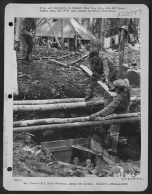 Thumbnail for Consolidated > Men of the 390th Bomb Squadron, 42nd Bomb Group digging a well to supply water at Mar Strip, near Cape Sansapor on the Dutch New Guinea mainland. Even though the temperature is hot, the men work fully clothed as a protection against Typhus. August