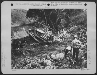 Thumbnail for Consolidated > Enticed by a few worldly goods, the engineers at a neighboring base brought over their bulldozer and scooped out a nice swimming pool for the convalescing men at Hollandia, Dutch New Guinea. Here the AAF Convalescent Training Program was inaugrated