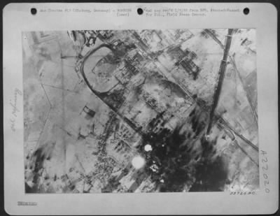 Thumbnail for Consolidated > Fiery balls of exploding oil tanks rush skyward from the Misburg oil refinery near Hanover during the attack by Third Bombardment Division Boeing B-17 Flying Fortresses, yesterday. (31 Dec 44) Attack was made by part of a large force of over 1,300