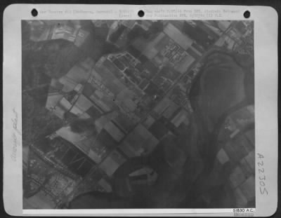 Consolidated > TARGET FOR LIBERATORS--Two of three major buildings at the Arado Aircraft Works in Rathenow, 40 miles west of Berlin, received direct hits and fires were started in the barracks, area as U.S. 8th AF Consolidated B-24s attacked on 18 April 44. Smoke
