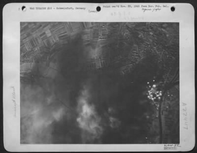 Consolidated > ON THE RIGHT BEARINGS-These photos released by Eighth Air Force Bomber Command headquarters today show the huge Schweinfurt Ball and Roller Bearings factory area blanketed by bombs from Flying Fortresses in their great attack of October 14th in