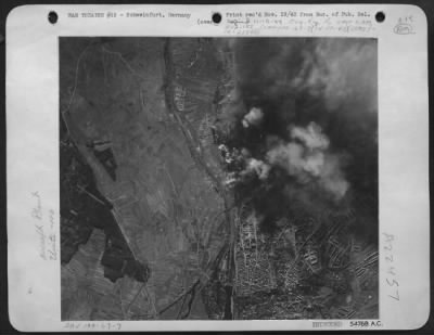 Thumbnail for Consolidated > ON THE RIGHT BEARINGS-These photos released by Eighth Air Force Bomber Command headquarters today show the huge Schweinfurt Ball and Roller Bearings factory area blanketed by bombs from Flying Fortresses in their great attack of October 14th in