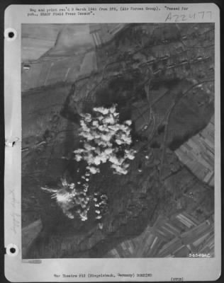 Consolidated > The first strings of incendiary and high explosive bombs begin the plastering of a German ammunition and suspected V-2 storage site at Siegelsbach, 18 miles southeast of Heidelberg, by First Tactical Air Force Martin B-26 Marauders. The explosive