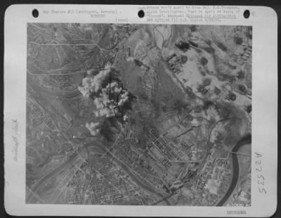 Thumbnail for Consolidated > Stuttgart Ball Bearing Works, Stuttgart, Germany. During bombing-Smoke bomb is no longer visible as one-hundred-pound incendiaries send up plumes of their own. Fifty heavies made the attack on 25 Feb 44, hit machine shop, finishing shop, and office