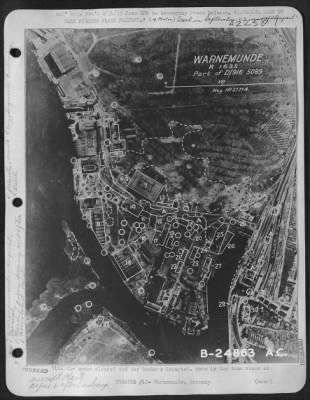 Thumbnail for Consolidated > With the smoke cleared and our bombers departed, here is the same scene as caught by an American reconnaissance plane, graphically showing the devastation wrought by the attack. Of the plant's 27 buildings, 18 were hit, of which five were totally or