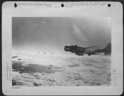 Thumbnail for Consolidated > Boeing B-17 Flying Fortresses of the 8th Air Force bombed German airfield at Wiesbaden, west of Frankfurt, 11/10/44 through broken clouds. Attack, made in support of Gen. Patton's 3rd Army advance, was designed to ground German aircraft.