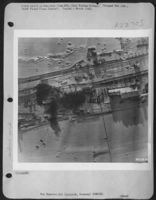 Consolidated > The marshalling yard at Zulpich, Germany has received several hits causing much damage as shown in this photo taken by 1st Lt. Arthur A. Degenhardt, 1496 Lawrence St., Rahway N.J., a North American P-51 reconnaissance pilot. Several locomotives, a