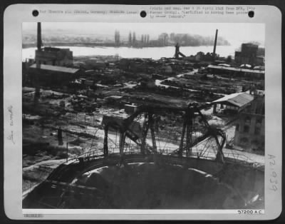 Thumbnail for Consolidated > Gas Works, Mainz, Germany -- An Illuminating Gas Storage Tank In The Foreground Is A Broken Steel Bubble -- One Of Two At The Mainz Plant Destroyed By Allied Bombs.  Between The Gas Tank And The River Are The Remains Of A Small Manufacturing Plant.  The R