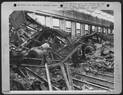 Consolidated > The Huge Wheels Of Machinery Manufacturing Oil For The German Armies And Luftwaffe Now Lie Still And Useless, Partially Hidden By The Debris Which Showered Down Following One Of The Many Air Attacks By The Us 8Th Af And The Raf On The Leuna Synthetic Oil