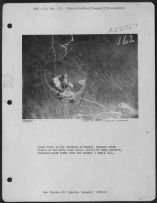 Thumbnail for Consolidated > Bombs Burst On The Airdrome At Munich, Germany After Planes Of The 100Th Bomb Group, Guided By Smoke Markers, Released Their Bombs Over The Target, 9 April 1945.