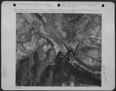 Thumbnail for Consolidated > Bombs Burst On The Railroad Bridge At Neckarelz, Germany During A Bombing Mission By Planes Of The 320Th Bombardment Group, 443 Bomb. Squadron On March 23 1945.