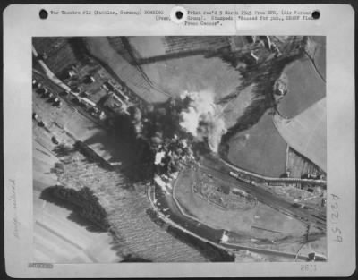 Thumbnail for Consolidated > Well Developed Bomb Bursts Pattern A Railroad Bridge And Adjacent Highway Span At Nuttlar, Germany Near Bestwig, Following An Attack By 9Th Bombardment Division Martin B-26 Marauders Feb. 22 1945.  Direct Hits Were Scored On The Railroad Bridge.