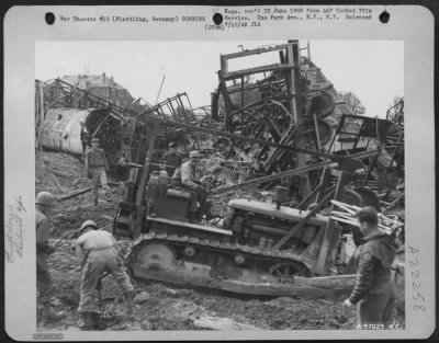 Thumbnail for Consolidated > Bulldozer Filling In Bomb Craters In The Marshalling Yards At Plattling, Germany After Bombing By 15Th Af.  June 1945.