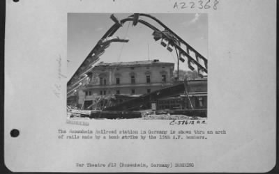 Thumbnail for Consolidated > The Rosenheim Railroad Station In Germany Is Shown Thru An Arch Of Rails Made By A Bomb Strike By The 15Th Af Bombers.