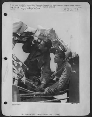 Thumbnail for Consolidated > Enemy fighters on a Weiner Nuestadt attack placed a lucky rocket shot through the rudder of "Old Number 34," a Consolidated B-24 Liberator of the 15th AAF. It was a lucky crew that brought the plane home. Pictured left to right is pilot, Lt. Irving