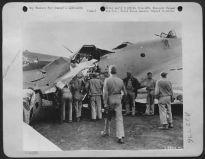 Thumbnail for Consolidated > ITALY--Surveying the "Miracle fort" after its safe landing, crew members of a 15th AAF base find it hard to believe that the plane reached home 600 miles away despite the fact that it was ripped wide open in the waist section by enemy flak.