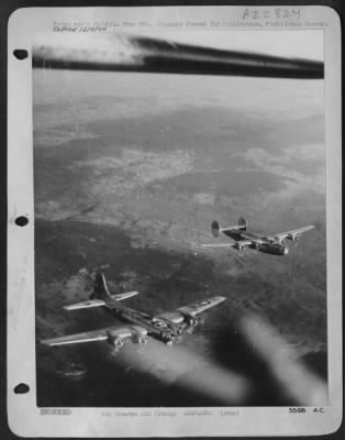 Thumbnail for Consolidated > ITALY-A Consolidated B-24 Liberator and a Boeing B-17 Flying Fortress, both of the 15th Air Force fly in the same formation when they return from an attack against targets in Vienna on October 7, 1944.