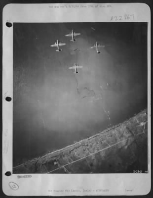 Thumbnail for Consolidated > AAF Martin B-26 Marauder bombers of the 12th AAF cross the Anzio bridgehead as Allied troops and materials are being unloaded along the beaches. The Marauder bombers of the "Bomerang" group are on their way home after attacking German troop