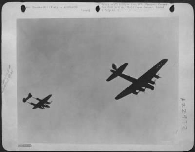 Thumbnail for Consolidated > Escorting this Boeing B-17 of the 15th AF, as it wings its way to attack German installations and factories, is this Lockheed P-38 Lightning fighter. P38's have been successfully used as fighter escort to heavy bombers accounting for a considerable