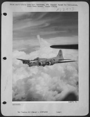 Thumbnail for Consolidated > This silver Boeing B-17 Flying Fortress of the 15th AAF rides serenely over billowing clouds as it wings it way toward its target. B-17 Fortresses have been part of the heavy bomber formations that have recently been smashing at the Hun's oil supply