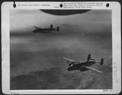 Thumbnail for Consolidated > Soaring over the mountainous terrain of Italy above the Fifth Army battle line, B-25 Mitchell Bombers of the 12th AAF are on their way to hit communication centers behind the German lines. The Mitchells are siding our ground troops by cutting off the