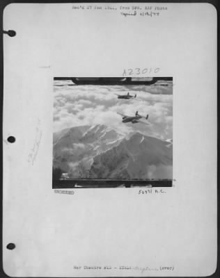 Consolidated > Far below these 12th AAF B-25 Mitchell bombers of the "Avengers" medium bombardment group group are gun positions and command posts of the German forces holding up the advance of Allied troops in Italy. The jagged snow-covered terrain explains