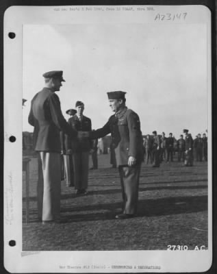 Consolidated > M/Sgt Harry Turner, Manchester, N.H. receives a Legion of Merit award from Brig. Gen. Joseph H. Atkinson, Dalhart, Texas, for "Outstanding Services" as chief of repairs and maintenance in an AAF fighter group in the 15th Air Force.