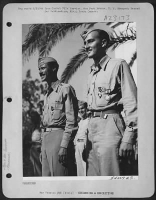 Thumbnail for Consolidated > These two members of the 1st Combat Camera Unit, 15th Air Force, Italy, were shot down over Rumania, languished in prisoner of War camps, and then flown back to Italy when the Balkan Country surrendered. Left to right: 1st Lt. Sherwood A. Mark