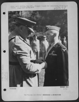 Thumbnail for Consolidated > ITALY-General Sir Henry Maitland Wilson, supreme allied commander in the Mediterranean theatre places the Order of Knight of the British Empire on Major General John K. Cannon, Commanding General of the 12th Air Force. This award was made to the