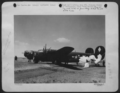 Thumbnail for Consolidated > Its Hydraulic System Shot Out By Flak Over The Ferrara Railroad Bridge In Northern Italy, This Consolidated B-24 Liberator Bomber Of The 15Th Af Landed With The Aid Of Parachutes Preventing The Lib From Overshooting The Landing Strip.