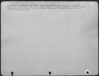 Thumbnail for Consolidated > With Only The Nose Wheel Down, The Crippled North American B-25 Mitchell Bomber 'Angel Of Mercy' Comes In For A Belly Landing After A Rough Mission.  Enemy Flak Wrecked The Hydraulic System And The Main Landing Gear Would Not Go Down, So The Crew Decided