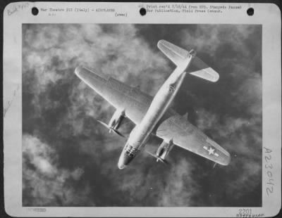 Thumbnail for Consolidated > Looking Like A Scale Model, Suspended In Artificial Surroundings, This Martin B-26 Marauder Of Major General Cannon'S 1St Tact. Af Heads Out Across The Sea, Above The Clouds, After Successfully Attacking Fuel Storage Facilities At Savona, Italy, As Medite