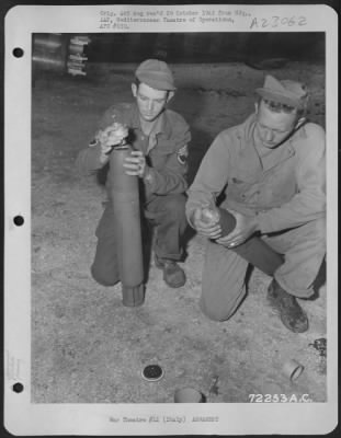 Thumbnail for Consolidated > Armorers Fuse Rocket Projectiles Before Loading Them Under The Wings Of A Republic P-47 Thunderbolt Of The 12Th Af, At A Base In Italy.