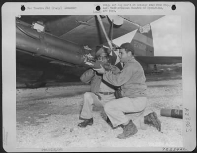 Thumbnail for Consolidated > Armorers Load Rocketer On A Republic P-47 Thunderbolt Of The 12Th Af, At A Base In Italy.