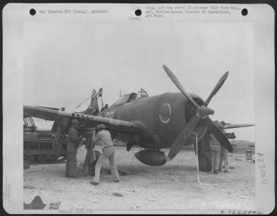 Thumbnail for Consolidated > Armorers Load Rockets On A Republic P-47 Thunderbolt Of The 12Th Af, At A Base In Italy.