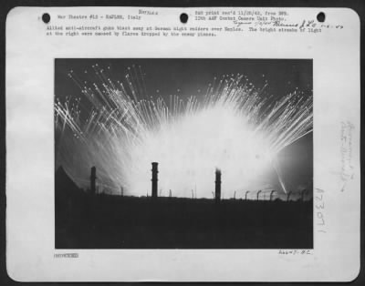 Consolidated > These Brilliant Streaks Of Light Were Caused By Allied Anti-Aircraft Fire, Reaching Out For Raiding Nazi Planes Over Bari, On The Adriatic Coast Of Italy.  The Heavier, Wavy Streaks Were Caused By Flares From The German Craft.  In Spite Of The Darkness Of