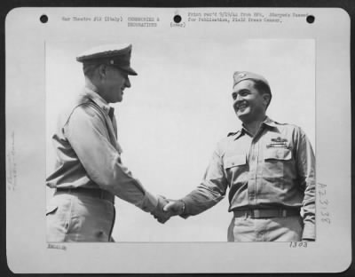 Consolidated > Major General Nathan F. Twining (Left) Commanding General Of The 15Th Af In Italy, Congratulates Colonel Robert Eaton, Commanding Officer Of A Consolidated B-24 Liberator Bomb Group, For The Award Of 2 Presidential Citations To His Unit.  One Was For The