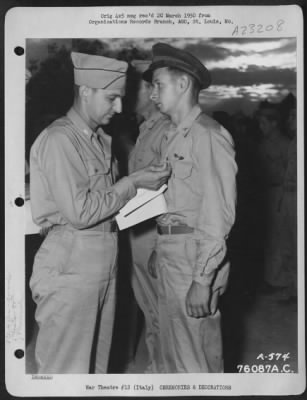 Consolidated > Major Humbrecht Presents An Award To An Officer Of The 90Th Photo Reconnaissance Wing During A Ceremony Somewhere In Italy.