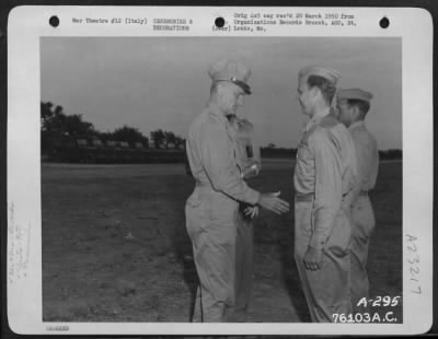 Thumbnail for Consolidated > Lt. Gen. Carl A. Spaatz Congratulates Capt. Humbrecht For Receiving The Distinguished Flying Cross At A Ceremony Somewhere In Italy.  90Th Photo Reconnaissance Wing.