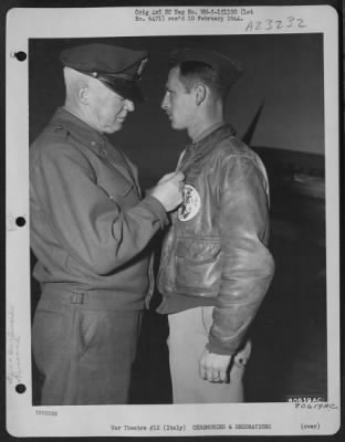 Thumbnail for Consolidated > Gen. Henry H. Arnold, Chief Of The Air Force, Presents The Distinguished Flying Cross To 1St Lt. Robert W. Weismuller Of Cincinnati, Ohio During A Ceremony In The Pogmigliano Sector, Italy, 10 Dec. 1943.