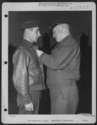 Consolidated > Gen. Henry H. Arnold, Chief Of The Air Force, Presents The Distinguished Flying Cross To 1St Lt. Michael P. Yannell Of Summit, Nj, During A Ceremony In The Pogmigliano Sector, Italy, 10 Dec. 1943.