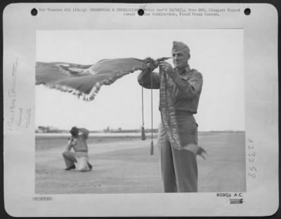 Consolidated > Major General Nathan F. Twining, Commanding Gen. Of The 15Th Af In Italy Ties The Presidential Citation Ribbon To The Group Banner Of The 98Th Bomb Group At Presentation Ceremonies Held In Italy.  The Second Citation For The Consolidated B-24 Liberator Gr