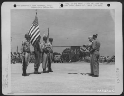 Consolidated > Major General Nathan F. Twining Presents The 376Th Bomb Group With Two Streamers For Their Banner Representing The Two Presidential Citations To The Group, One For Their Part In The Libyian Campaign And One For The Ploesti Raid, At A Ceremony In San Pancr