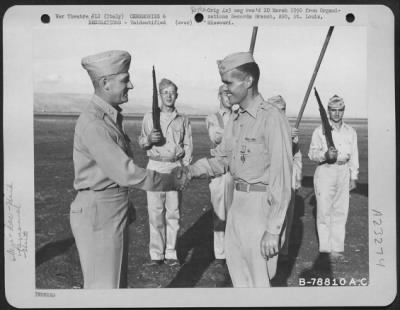 Consolidated > Major General Nathan F. Twining Presents The Distinguished Flying Cross To A Member Of The 94Th Fighter Squadron, 1St Fighter Group During A Ceremony At An Airbase Somewhere In Italy.