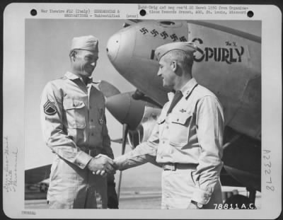 Consolidated > Major General Nathan F. Twining Presents The Legion Of Merit To A Member Of The 94Th Fighter Squadron, 1St Fighter Group During A Ceremony At An Airbase Somewhere In Italy.