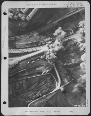 Consolidated > Marshalling yards at Siena, Italy, important rail junction point in the Florence-Rome railroad network, is the target of B-26 Marauders of the 12th AAF. Bomb bursts in the yards are clearly shown as they destroy trackage, railroad station, warehouses